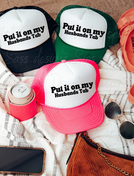 Put it on my husbands tab Trucker Hat